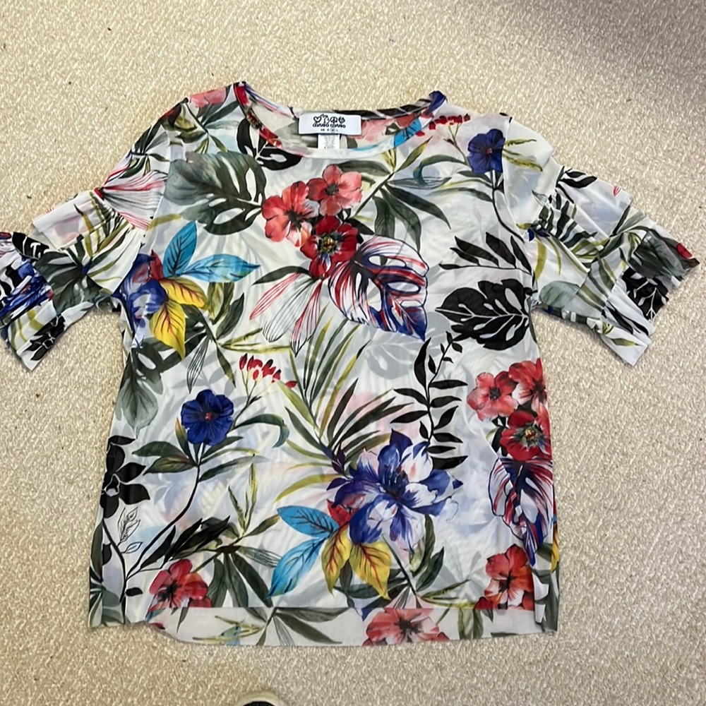 Fun shirt that pairs well with black pants jeans and white pants